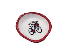 Red/Black dog on bike