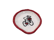 Red/Black dog on bike