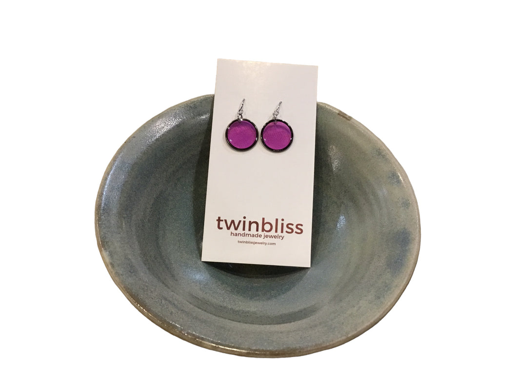 Black circle in purple earrings