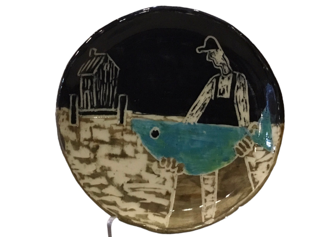 Fisherman Holding Fish Dish