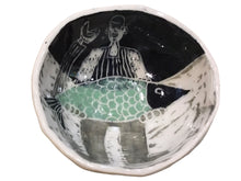 Fisherman Holding Fish Bowl