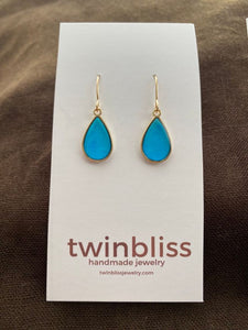 Small gold drop in blue earrings