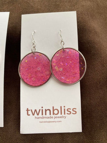 Large silver circle in pink earrings