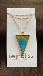Shield blue/yellow on gold necklace
