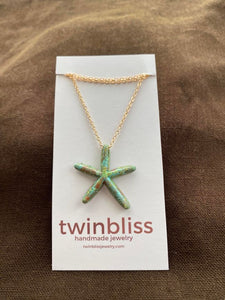 Sedona patina starfish on gold necklace