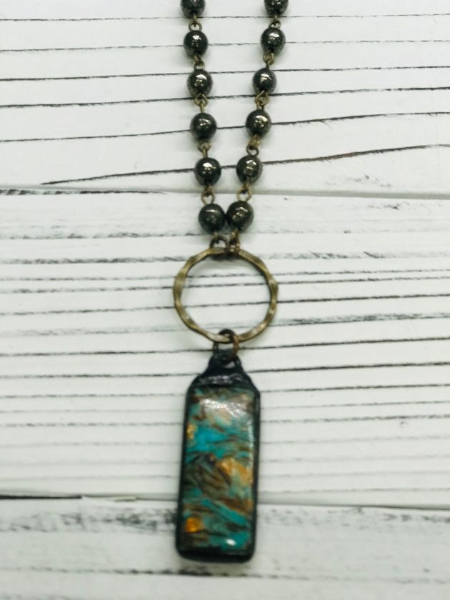 Oblong copper pendant