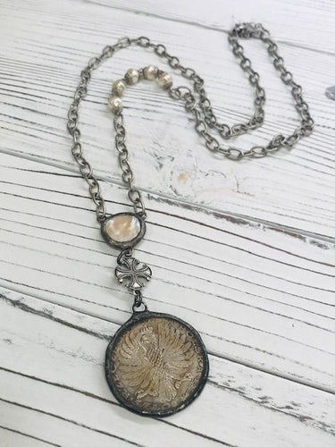 Coin w/ bird and pearl cross