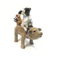 Brown Pig with a Sheep and Chicken Hitching a Ride