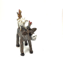 Brown Cow with Stacked Animals