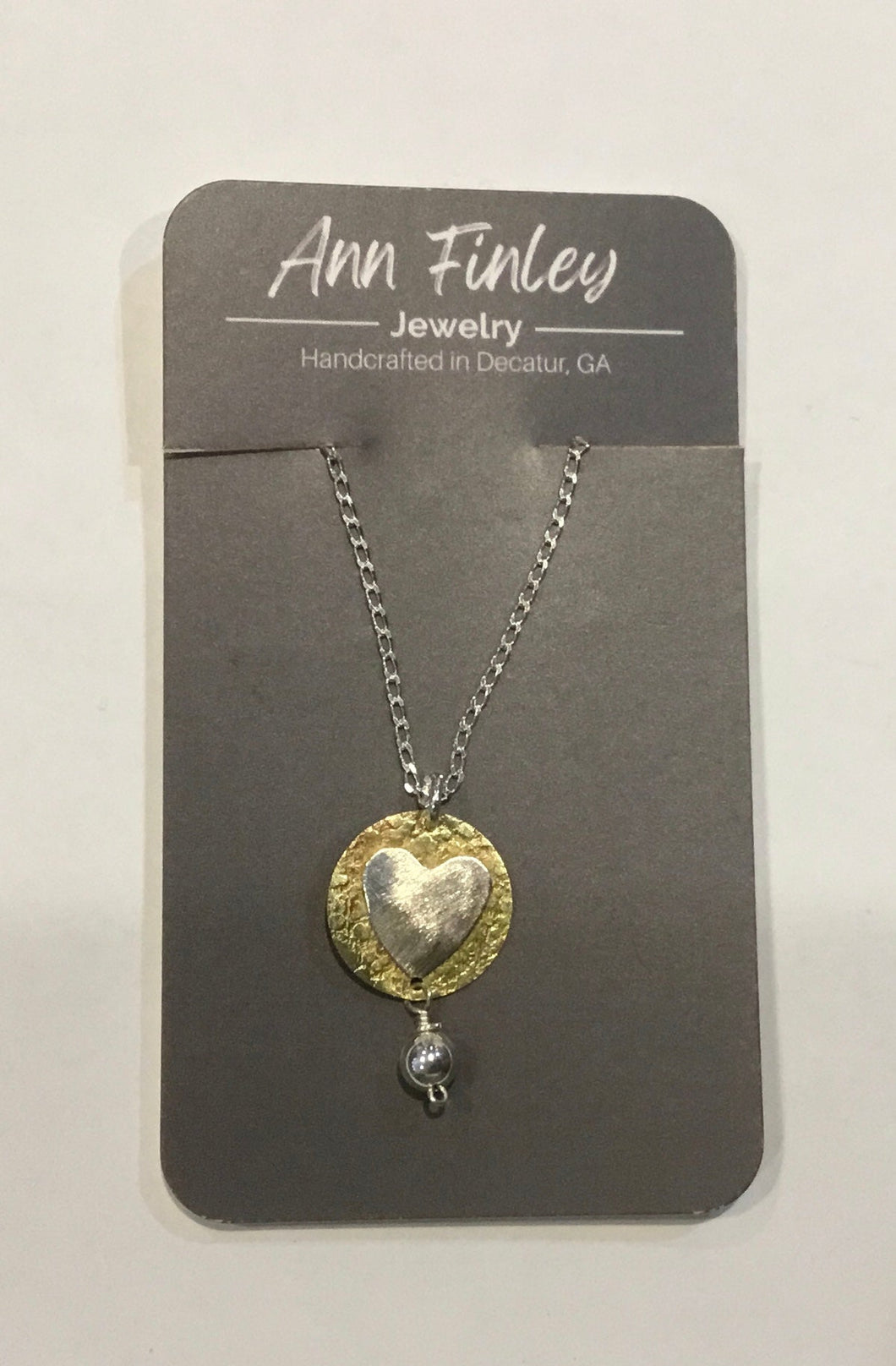 .925 Heart on brass disc with bead