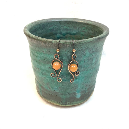 Curls with orange bead Copper Earrings