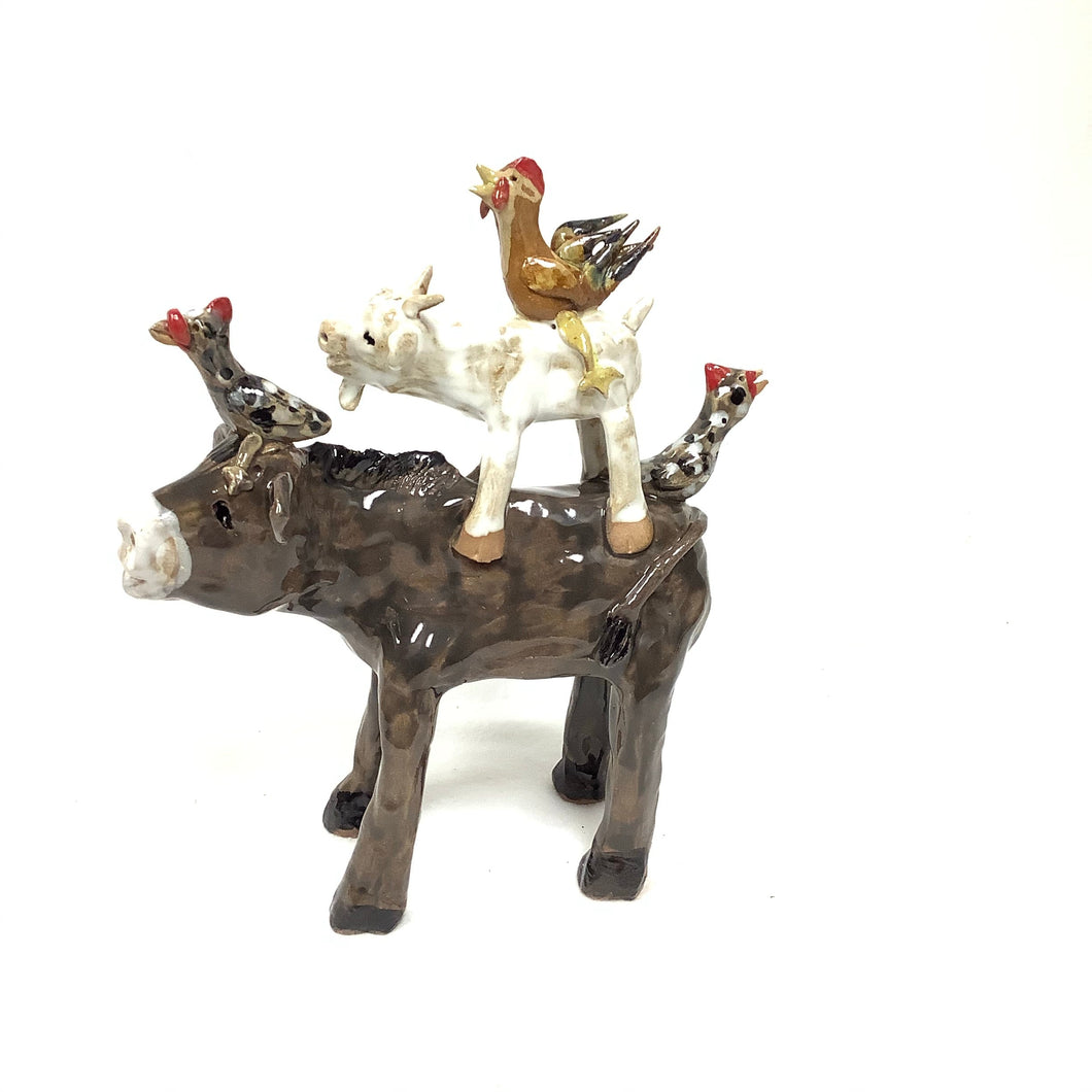 Brown Cow with Stacked Animals