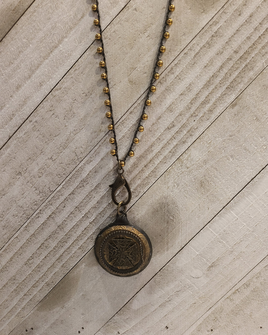 Brass button pendant w/ Gold crocheted chain