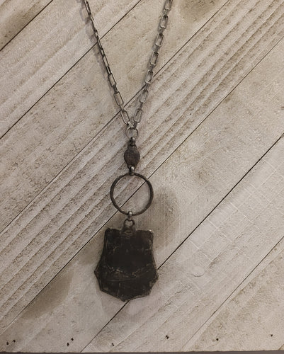 Braided leather shield with suede cord